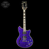 Purple electric guitar on a black background with 'Tone Shop' logo.