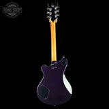 Back view of a purple electric guitar with a black pickguard on a white background.