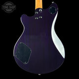 Back view of a purple electric guitar with a visible brand logo in the corner.