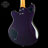 Purple electric guitar body with a visible brand logo in the corner.