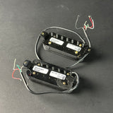 Two guitar pickups with Duncan Solar branding on a dark surface