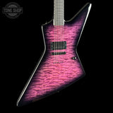 A custom electric guitar with a distinctive angular body, featuring a vibrant pink and purple quilted maple top with a dark fade, set against a solid black background.