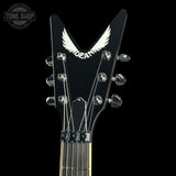 Guitar headstock with 'Dean' logo on a black background