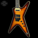Electric guitar with a sunburst finish on a black background, featuring the Tone Shop logo.