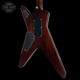 Glossy brown electric guitar on a black background with 'Tone Shop' logo.