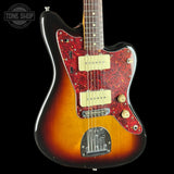 Electric guitar with a sunburst finish and red pickguard on a black background, featuring the Tone Shop logo.