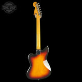 Electric guitar with sunburst finish on a black background, featuring 'Tone Shop' logo.