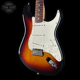 Electric guitar with a sunburst finish on a black background, featuring the Tone Shop logo.