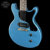 Blue electric guitar on a black background with 'Tone Shop' logo.