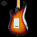 Fender electric guitar with a three-tone sunburst finish on a black background