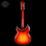 Red electric guitar on a black background with 'Tone Shop' logo.