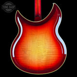 Close-up of a red electric guitar body with a visible brand logo in the corner.