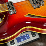 Guitar on a digital scale displaying weight