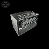 Guitar amplifier with visible branding on a black background