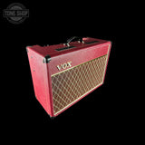 Red VOX guitar amplifier on a black background with 'Tone Shop' logo.