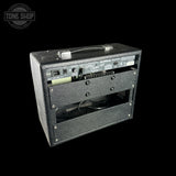 Guitar amplifier with visible brand logo on a black background