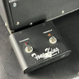 Tone King guitar effects pedal on a black surface