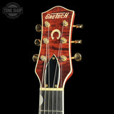 Gretsch guitar headstock on a black background