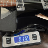 Used 2024 Rickenbacker 330/12 Jetglo on scale displaying weight.