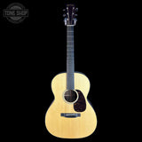 Acoustic guitar on a black background with 'Tone Shop' logo.