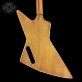 Wooden guitar body with 'Tone Shop' logo in the corner