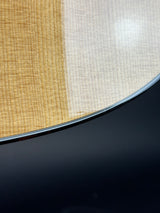 Close-up of a textured surface with a gradient from beige to black.