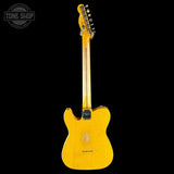 A yellow electric guitar shown from the back against a solid black background, with a Tone Shop watermark in the top-left corner.