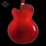 Red guitar body on a black background with 'Tone Shop' logo.