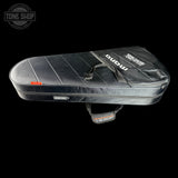Black guitar case with visible branding on a black background