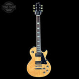Electric guitar with a visible brand logo on a black background