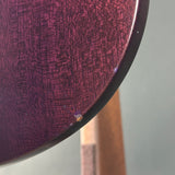 Close-up of a textured purple surface with a blurred background