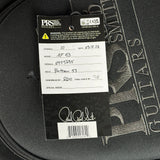 A close-up of aPRS Music Smith Guitars hanging tag on a black guitar case. The tag shows the PRS logo, a product warning, and handwritten details including model 'AF 63' and serial number '6925235'.