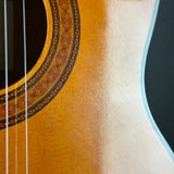 Close-up of an acoustic guitar's soundhole and body