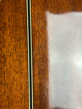 Close-up of a wooden surface with a white rectangular area and black strip.