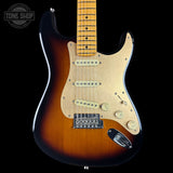 Electric guitar with a sunburst finish on a black background, featuring the Tone Shop logo.