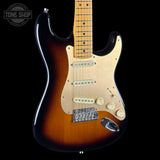 Electric guitar with a sunburst finish on a black background, featuring the Tone Shop logo.