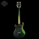A green glitter electric guitar shown from the back against a solid black background, with a Tone Shop watermark in the top-left corner.