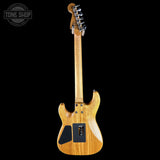 Wooden electric guitar on a black background with 'Tone Shop' logo.