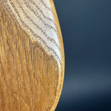 Close-up of a wooden surface with a dark blue gradient background