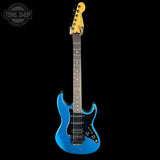 Blue electric guitar with a yellow pickguard on a black background, featuring 'Tone Shop' logo.