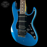 Blue electric guitar on a black background with 'Tone Shop' logo.