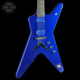 A blue glitter electric guitar with a star-shaped body, shown against a solid black background. The guitar features blue humbucker pickups, chrome hardware, and a dark fretboard.