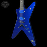 A blue electric guitar with a star-shaped body, featuring a blue glitter finish, blue humbucker pickups, and chrome hardware, shown against a solid black background with a Tone Shop watermark in the top-left corner.