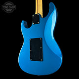 Blue electric guitar with a black pickguard on a white background, featuring 'Tone Shop' branding.