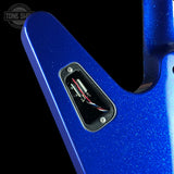 Close-up of a blue metallic guitar body showing the electronics cavity with internal wiring, on a black background. A Tone Show watermark is visible in the top-left corner.