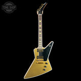 Electric guitar with a gold and black design on a white background