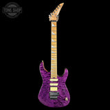 Purple electric guitar with a black background