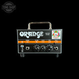 Orange Micro Dark guitar amp head against a solid black background, featuring a chrome handle, black faceplate with white lettering, and orange accent strip.