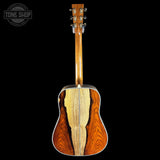 Wooden acoustic guitar on a black background with 'Tone Shop' logo.