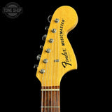 Fender Musicmaster guitar headstock on a black background